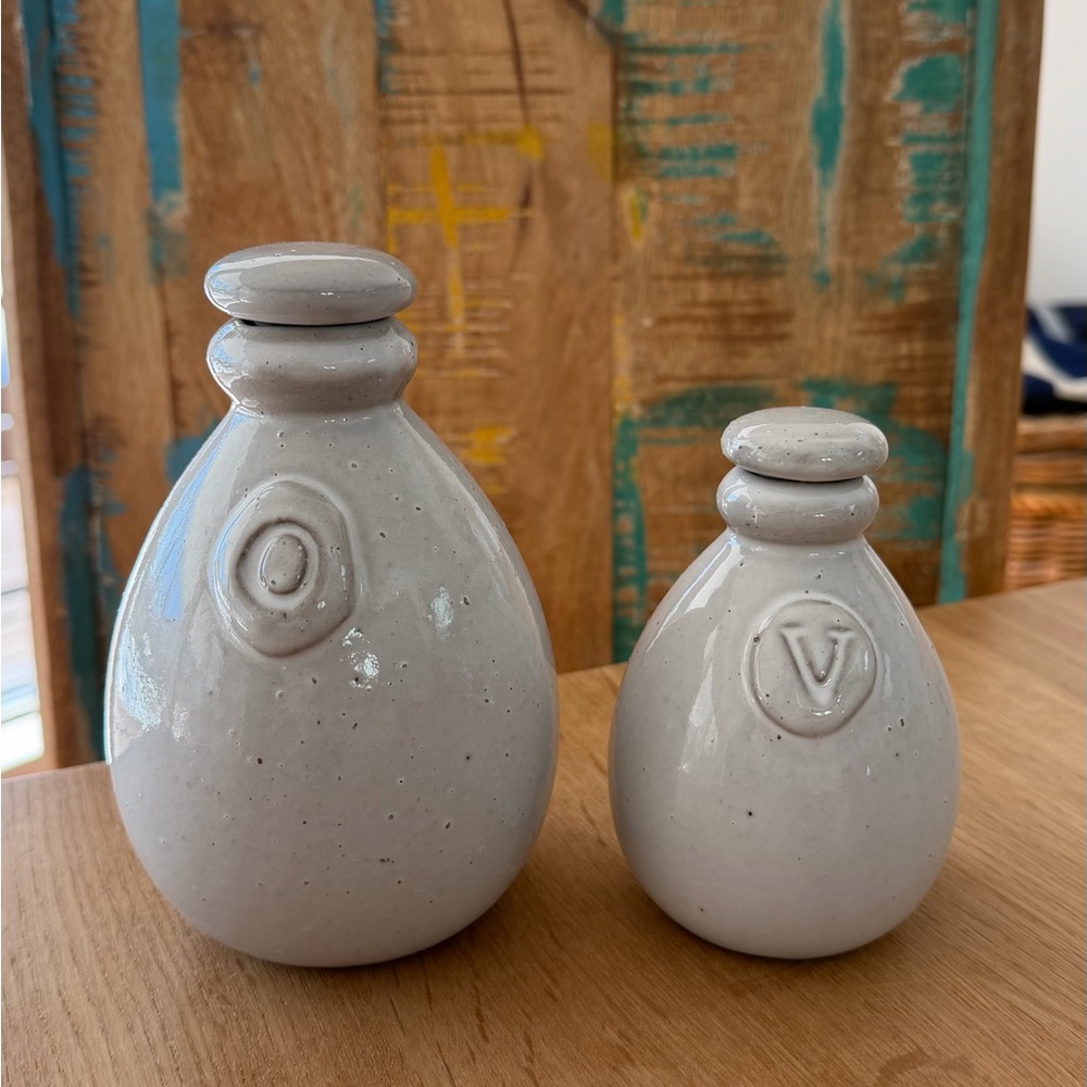 Crate and barrel oil and vinegar ceramic cruet set. Oatmeal glaze.